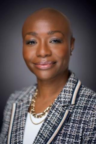 Photo of Natasha Garcia against a dark background